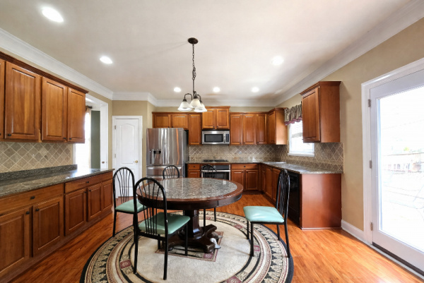 Spacious kitchen with round dining table.png